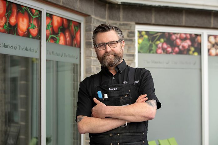 As the owner of The Market in Lakefield, Darren Murphy has become known to customers at "Murph at The Market" from his entertaining social media reels where he shares information about new products available in store and offers recipe suggestions. (Photo: Jordan Lyall Photography)
