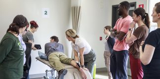 From athletes to new moms and seniors, Trent Health in Motion supports integrated and evidence-informed care to empower healthy living Trent Health in Motion sports medicine physician Dr. Jessica Hewitt shows her colleagues how to use a portable ultrasound unit during a team in-service, illustrating the clinic's integrated and collaborative approach with a focus on evidence-informed healthcare. Located within the Trent University Athletics Centre in Peterborough, Trent Health in Motion provides personalized care for sports rehabilitation, injury recovery, and overall wellness, with services including orthopedic physiotherapy, pelvic physiotherapy, chiropractic care, massage therapy, personal training, dietitian services, hydrotherapy, and sport medicine physician consultations. (Photo courtesy of Trent Health in Motion)