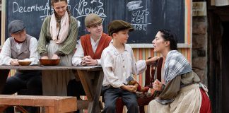 Actor Lindsay Wilson talks to Jasper Chesser in a scene from "Wild Irish Geese" as (left to right) Padrick Wilson, Indigo Chesser, and Darragh O'Connell look on during a media day event at 4th Line Theatre in Millbrook on July 22, 2026. Megan Murphy's play about the Peter Robinson emigration returns to the Winslow Farm from August 4 to 29 after its sold-out world premiere last summer. (Photo: Jordan Lyall / kawarthaNOW)