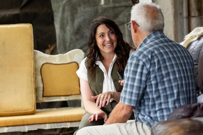"Wild Irish Geese" playwright Megan Murphy speaks with kawarthaNOW's Paul Rellinger during a media day event at 4th Line Theatre in Millbrook on July 22, 2026. Murphy will reprise her role as seanchaí for the return run of her play from August 4 to 29 at the Winslow Farm. (Photo: Jordan Lyall / kawarthaNOW)