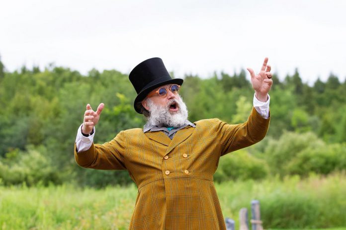 M. John Kennedy as Upper Canada politician Peter Robinson rapping during a media day event for "Wild Irish Geese" at 4th Line Theatre in Millbrook on July 22, 2026. Kennedy is reprising his role in Megan Murphy's play about the Peter Robinson emigration, which returns to the Winslow Farm from August 4 to 29 after its sold-out world premiere last summer. (Photo: Jordan Lyall / kawarthaNOW)