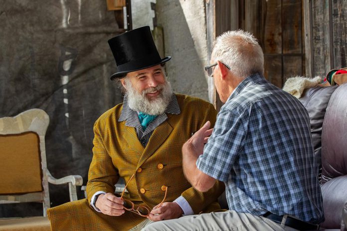 "Wild Irish Geese" actor M. John Kennedy speaks with kawarthaNOW's Paul Rellinger during a media day event at 4th Line Theatre in Millbrook on July 22, 2026. Murphy will reprise her role as seanchaí for the return run of her play from August 4 to 29 at the Winslow Farm. (Photo: Jordan Lyall / kawarthaNOW)