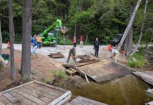 From June 26 to 28, 2026, a group of volunteers from a wide range of organizations came together at the Little Gull Lake Marina on Mississagua Lake and the Gold Lake boat launch to remove more than 60 abandoned docks and other waste volunteers collected from the Catchacoma-Mississagua lakes system as part of the Abandoned Dock Initiative led by the Cavendish Community Ratepayers Association Inc. To continue the cleanup and remove a total of more than 100 abandoned docks, organizers have launched a GoFundMe with the goal of raising $20,000. (Photo courtesy of Abandoned Dock Initiative)