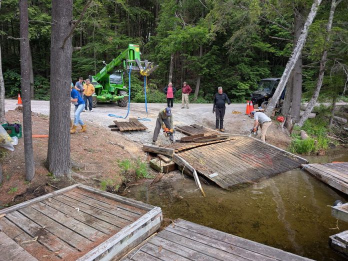 From June 26 to 28, 2026, a group of volunteers from a wide range of organizations came together at the Little Gull Lake Marina on Mississagua Lake and the Gold Lake boat launch to remove more than 60 abandoned docks and other waste volunteers collected from the Catchacoma-Mississagua lakes system as part of the Abandoned Dock Initiative led by the Cavendish Community Ratepayers Association Inc. To continue the cleanup and remove a total of more than 100 abandoned docks, organizers have launched a GoFundMe with the goal of raising $20,000. (Photo courtesy of Abandoned Dock Initiative)