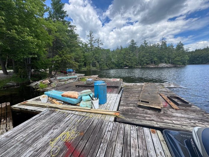 The Cavendish Community Ratepayers Association Inc. is leading the multi-organization Abandoned Dock Initiative that aims to remove abandoned docks from the shores of lakes in the Catchacoma-Mississagua lake system in Trent Lakes. Often dumped by property owners in lake bays when they install new docks because of the difficulty and cost in properly disposing of them, the abandoned docks are a hazard for boaters and other watercraft operators, are dangerous for wildlife and the environment, and are an eyesore for lake residents. (Photo courtesy of Abandoned Dock Initiative)