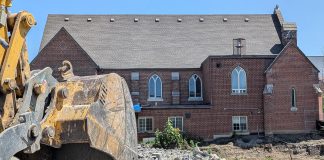 Demolition has begun at Mark Street United Church site as 17-storey East City project moves ahead A view of the west side of Mark Street United Church at 90 Hunter Street East in Peterborough's East City as demolition continues of the church's former Christian Education Centre, the site of TVM Group's new 17-storey high-rise apartment building, on July 23, 2026. (Photo: Bruce Head / kawarthaNOW)