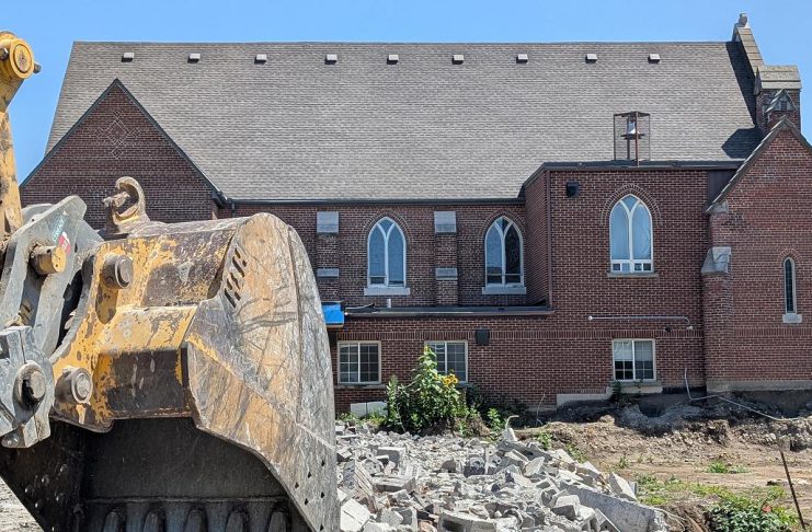 Demolition has begun at Mark Street United Church site as 17-storey East City project moves ahead A view of the west side of Mark Street United Church at 90 Hunter Street East in Peterborough's East City as demolition continues of the church's former Christian Education Centre, the site of TVM Group's new 17-storey high-rise apartment building, on July 23, 2026. (Photo: Bruce Head / kawarthaNOW)