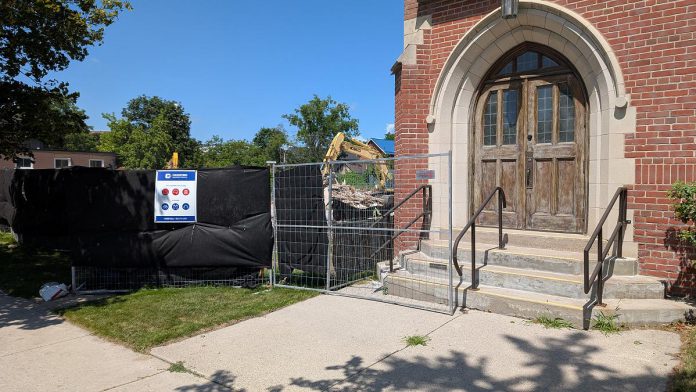 A view from Hunter Street East of the demolition beside Mark Street United Church in Peterborough's East City on July 23, 2026. (Photo: Bruce Head / kawarthaNOW)