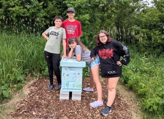 Youth-run small business Empire Beez installs beehive at community garden in Campbellford The youth team behind Empire Beez in Trent Hills (left to right: Sebastian Smith, Owen Musson, Eloise Smith, and Penelope McEvoy) stand with the beehive they installed at the Simpson Street Community Garden in Campbellford. The group launched the small business last year with the aim of raising awareness around honeybees and installing community beehives. The team will be unveiling the beehive during a garden talk held by IncrEdible Trent Hills on July 9, 2026. (Photo courtesy of Blythe Weber)