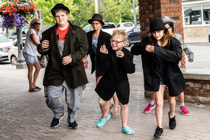 Youth participants of Globus Theatre's School of Dramatic Arts (SODA) summer performance camp held live performances in Bobcaygeon during the inaugural Downtown Detective Trail in 2021. From July 27 to 31, 2026 the interactive event will be presented for the first as a guided bus tour with stops around Bobcaygeon in celebration of the village's 150th anniversary. (Photo courtesy of Globus Theatre)