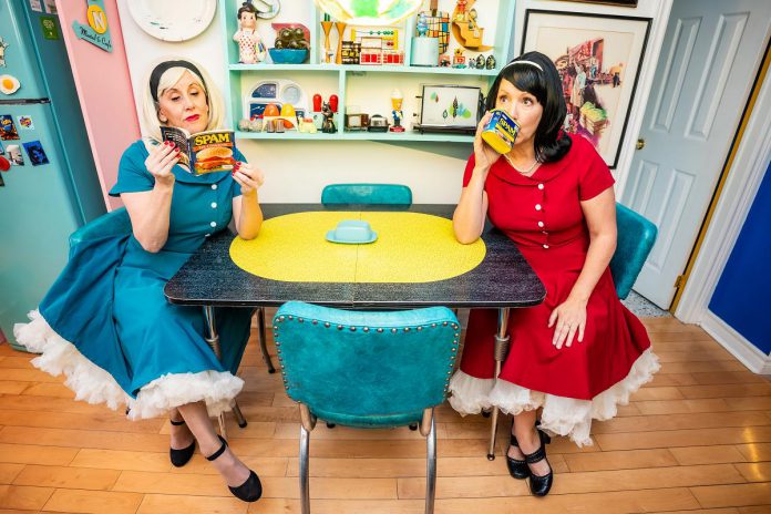 Karen Parker and Diana Frances perform as traditional housewives from the 1950s confronting the modern world in their interactive comedy "Leave it to Cleavage" at Globus Theatre in Bobcaygeon from July 30 to August 1, 2026. (Photo: Dahlia Katz) Karen Parker and Diana Frances perform as traditional housewives from the 1950s confronting the modern world in their interactive comedy "Leave it to Cleavage" at Globus Theatre in Bobcaygeon from July 30 to August 1, 2026. (Photo: Dahlia Katz)