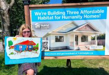 Three local families one step closer to affordable homeownership thanks to Habitat for Humanity Peterborough & Kawartha Region Eight-year-old Nora, who will be moving with her mother and grandmother into one of the three single-family homes in Norwood being constructed by Habitat for Humanity Peterborough & Kawartha Region (Habitat PKR), displays her artwork of the new home designed by Marshall Design Studios during a ground-breaking ceremony on July 14, 2026. (Photo: Habitat PKR)