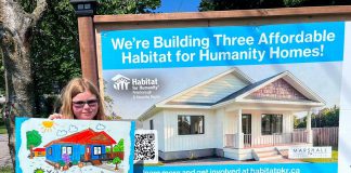 Three local families one step closer to affordable homeownership thanks to Habitat for Humanity Peterborough & Kawartha Region Eight-year-old Nora, who will be moving with her mother and grandmother into one of the three single-family homes in Norwood being constructed by Habitat for Humanity Peterborough & Kawartha Region (Habitat PKR), displays her artwork of the new home designed by Marshall Design Studios during a ground-breaking ceremony on July 14, 2026. (Photo: Habitat PKR)