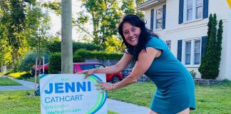 Brazen daylight theft of election lawn signs leaves Peterborough councillor candidate upset and disappointed Jenni Cathcart, one of four candidates vying for two Town Ward seats on Peterborough city council in the October municipal election, placing an election lawn sign. The first-time candidate tells kawarthaNOW that three of her election signs, including one on the lawn of her own Homewood Avenue home, were taken by someone in the middle of the day on July 20, 2026. (Photo courtesy of Jenni Cathcart campaign)
