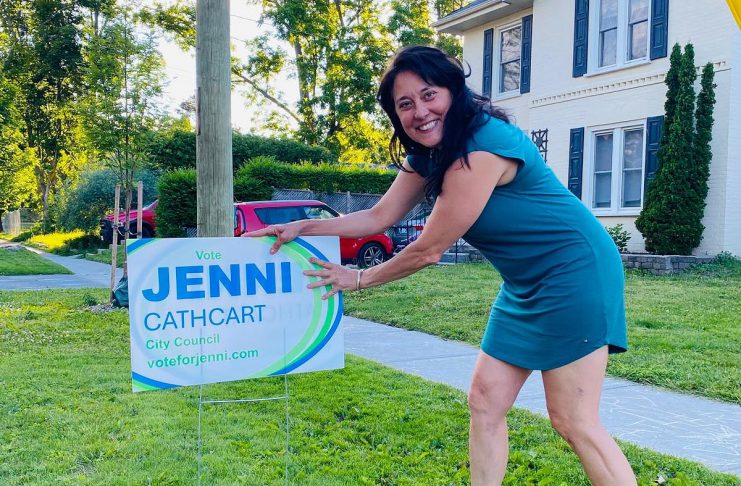 Brazen daylight theft of election lawn signs leaves Peterborough councillor candidate upset and disappointed Jenni Cathcart, one of four candidates vying for two Town Ward seats on Peterborough city council in the October municipal election, placing an election lawn sign. The first-time candidate tells kawarthaNOW that three of her election signs, including one on the lawn of her own Homewood Avenue home, were taken by someone in the middle of the day on July 20, 2026. (Photo courtesy of Jenni Cathcart campaign)