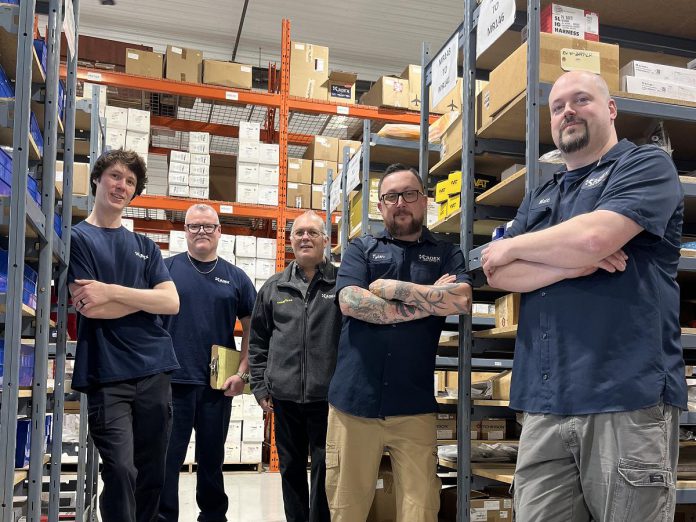 KADEX Aero Supply employees Aaron Davidson, Jeff Lang, Larry Mann, Tyler Primeau, and Matt Wyatt stand in the company's recently renovated and expanded warehouse at the Peterborough Airport. The upgrades include an additional 10,000 square feet of warehouse space, workspace adjustments that improve workflow, and the addition of tools and infrastructure that supports KADEX's commitment to green initiatives. The upgrades will improve workplace efficiency and operations to enhance customer experience. (Photo courtesy of KADEX Aero Supply)