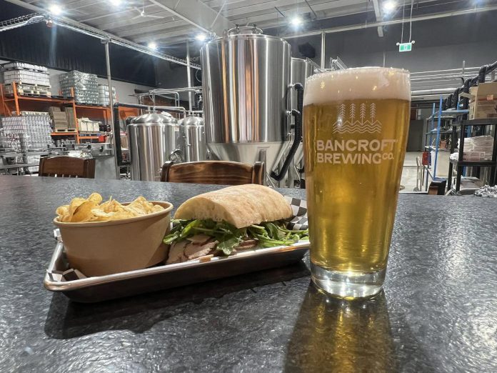 Since 2015, Bancroft Brewing Co. has been crafting beer "straight out of the Canadian Shield." At the brewery's new 12,000-square-foot location in Bancroft, guests can enjoy live music and other events while dining from the new Texas-style BBQ menu, and watching the brewing process as it happens on site. (Photo courtesy of Bancroft Brewing Co.)