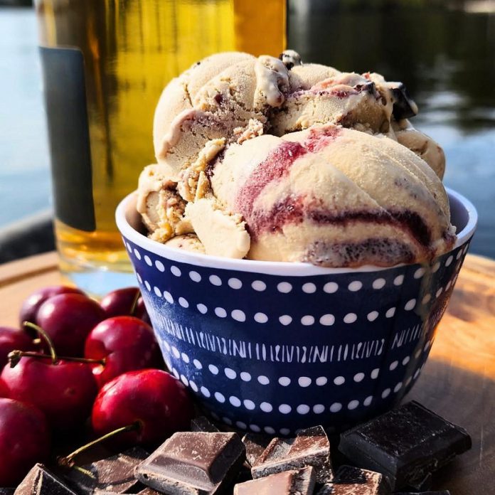 For summer 2026, Kawartha Dairy in Bobcaygeon has launched a new ice cream flavour called The Tragically Chip. The limited-edition collaboration with rock band The Tragically Hip features maple whisky-flavoured ice cream with dark chocolate chunks and black cherry ripple. In addition to the Bobcaygeon facility, Kawartha Dairy ice cream can be found at its outlet locations in Bancroft, Minden, Peterborough, Cobourg, and Lindsay and restaurants and shops across the region, with popular flavours available in grocery stores. (Photo courtesy of Kawartha Dairy)