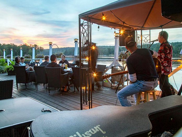 Overlooking Lake Kashagawigamog, the dockside patio at the Bonnie View Inn in Haliburton County serves resort guests and the public with classic comfort foods and specialty cocktails. With weekly music nights, weekday happy hours, and chances to get half-priced fish and chips on Fridays, the historic restaurant is a well-loved community staple. (Photo: Bonnie View Inn)