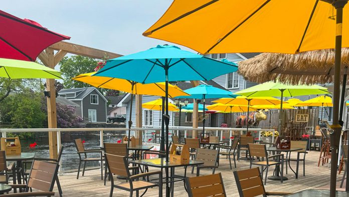 In 2020, the patio at The Royal Moose Grill & Waterfront Patio at the Bobcaygeon Inn was given an upgrade by new owners Joan and Daniel Reid. The upgrades included replacing the decking and replacing the wrought iron fencing with glass providing better view of the Bobcaygeon River. According to the owners, the dog-friendly patio is the largest waterfront patio in The Kawarthas. (Photo: Bobcaygeon Inn)