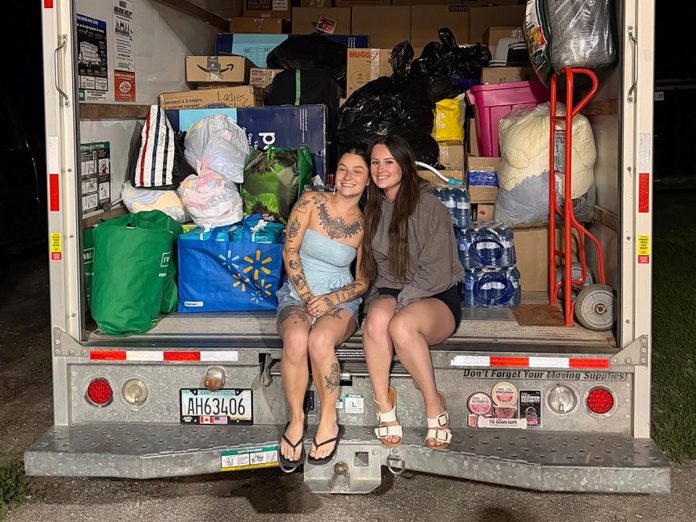 Sisters Bree and Chloe Paudash of Hiawatha First Nation collected a truckful of clothing, shoes, toiletries, toys, and more to donate to a wildfire relief drive being held by the First Nations Technical Institute (FNTI) and Honouring Indigenous Peoples (HIP). The donations will be sorted and delivered to individuals and families displaced by wildland fires in northwestern Ontario. (Photo courtesy of Bree Paudash)