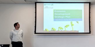 Kevin McPhillips of McSweeney & Associates, the consulting firm retained by the City of Peterborough to facilitiate the creation of the city's new five-year economic development strategic plan, waits to make a presentation during a community open house at Miskin Law Community Complex on July 20, 2026. (Photo: Bethan Bates / kawarthaNOW)