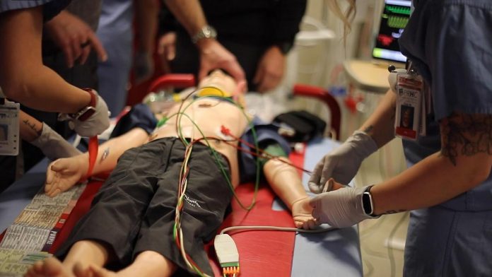 Staff of the Emergency Department at Peterborough Regional Health Centre (PRHC) undergo simulation training to prepare for real-life emergency scenarios using a pediatric mannequin. The PRHC Foundation has made it a priority to support the simulation training program by investing in a state-of-the-art adult mannequin with the help of donors. One of many areas of urgent care being supported through PRHC's $70 million Campaign for PRHC, the new simulation mannequin will better mimic human patients to improve learning outcomes, communication, and collaboration across teams during real-life emergencies. (Photo courtesy of PRHC Foundation)