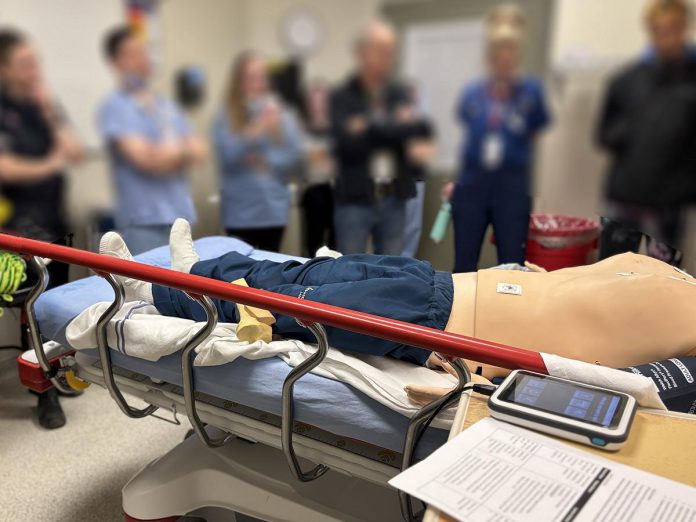 Simulation training using mannequins at the Emergency Department of Peterborough Regional Health Centre (PRHC) strengthens team communication, which indirectly benefits patient care. The training also helps break down the "perceived hierarchy" that exists between participating practitioners to ensure all team members are comfortable speaking up and sharing their concerns in support of better patient care. (Photo courtesy of PRHC Foundation)
