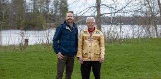 The Amazing Race Canada host Jon Montgomery with former Curve Lake First Nation chief and Order of Canada member Keith Knott at the pit stop for the fifth episode of season 12 of the reality TV series. The episode, which features locations across Peterborough and the Kawarthas including The Canadian Canoe Museum and the Ontario Turtle Conservation Centre in Peterborough, Kawartha Dairy in Bobcaygeon, and Lock 31 of the Trent-Severn Waterway in Buckhorn, airs on CTV on August 11, 2026 and streams on Crave the following day. (Photo: Bell Media)