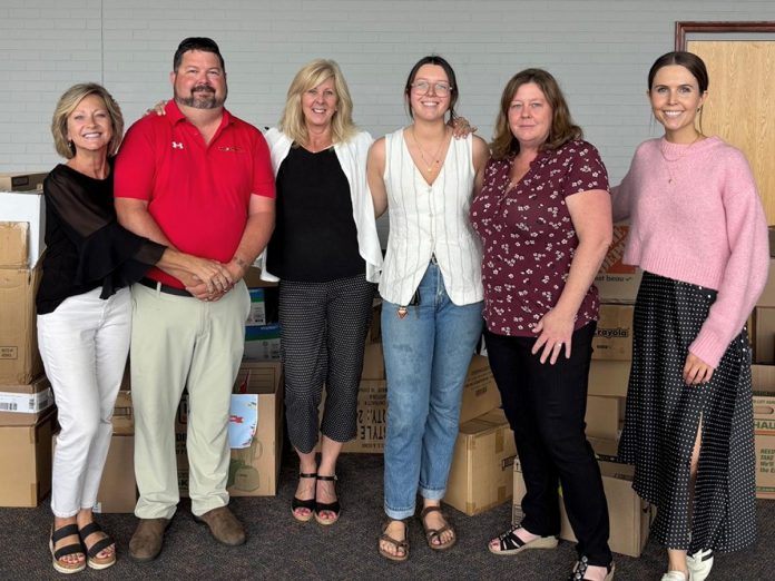 Left to right: Auto Connect Sales staff Cheryl Watson, Cory Fallis, and Alexis Raffan with the United Way Peterborough & District's campaign officer Adeline Murphy, former director of operations and revenue generation Rhonda Gilchrist, and campaign officer Elyse Belsey. Auto Connect Sales was one of many local businesses that supported the United Way's Backpacks for Success program in 2025 and, this year, is hosting the "Fill the Fords" donation blitz on August 8, 2026. (Photo courtesy of United Way Peterborough & District)