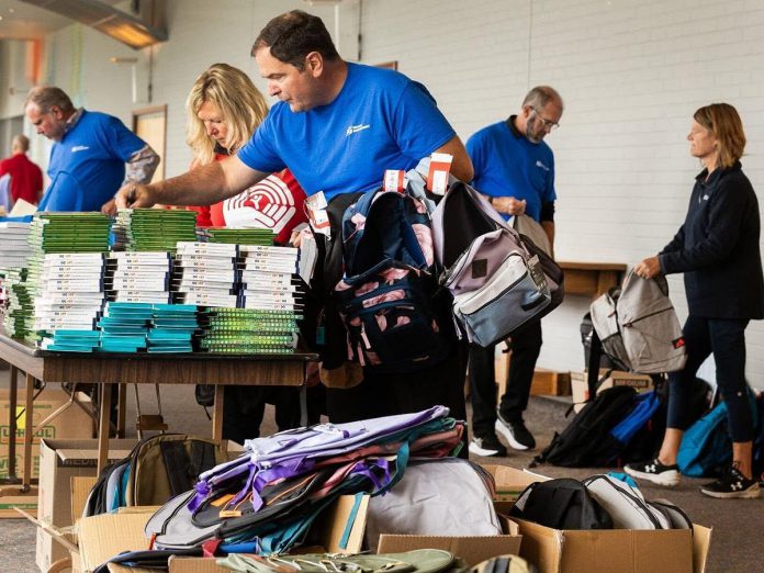 United Way Peterborough & District volunteers sort and fill backpacks with age-appropriate school supplies for financially vulnerable local students in kindergarten to grade 12 for the United Way's 2025 Backpacks for Success program. Many of the supplies were collected by businesses and community members who hosted drives on behalf of the program. Working in partnerships with local school boards and other partners, the United Way distributes the backpacks to address a rising demand made worse by the affordability crisis. (Photo courtesy of United Way Peterborough & District)
