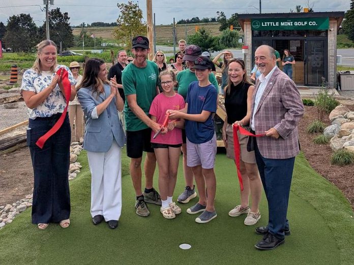 Owned by Sean Harris and A.J. Sainsbury, The Little Mini Golf Co. celebrated its grand opening at 17 Indacom Drive in Douro-Dummer on August 6, 2026 with a ribbon-cutting ceremony attended by Community Futures Peterborough executive director Devon Girard, Peterborough MP Emma Harrison, Douro-Dummer mayor Heather Watson, and Selwyn deputy mayor Ron Black. (Photo: Atticus Sikma / Peterborough County)