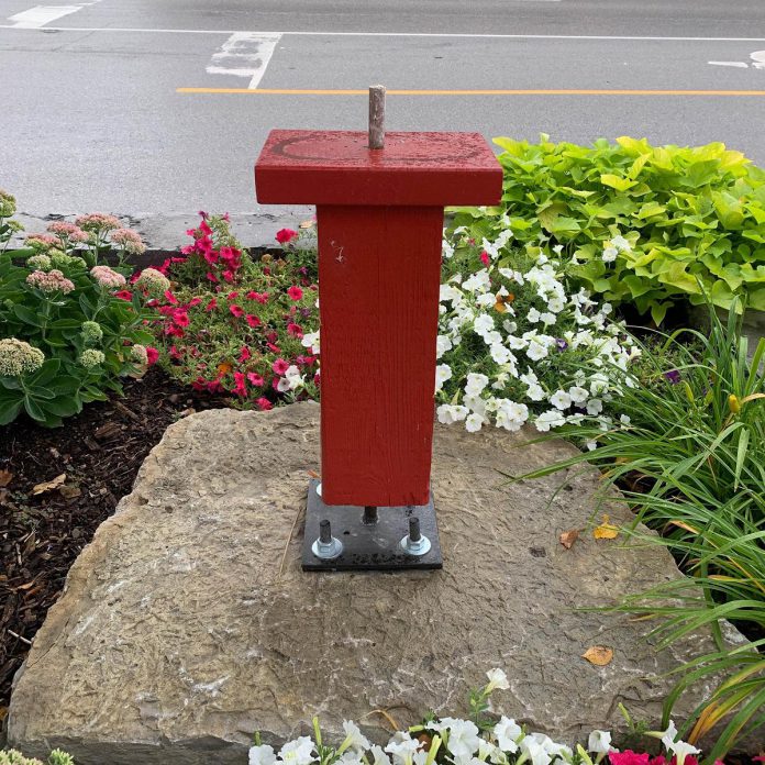 The empty plinth where artist Rosalinde Baumgartner's sculpture "Hans" was installed in downtown Fenelon Falls before it was stolen on August 23, 2026. (Photo: Fenelon Arts Committee)