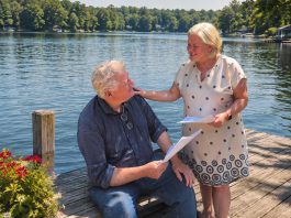 Globus Theatre founders and real-life couple James Barrett and Sarah Quick rehearsing their lines as Theo and Gwen in Kristen Da Silva's poignant romantic comedy "Beyond the Sea," which runs for 10 performances at the professional theatre company in Bobcaygeon from August 19 to 29, 2026. (Photo courtesy of Globus Theatre)