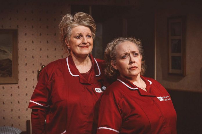 Melee Hutton as Francis Shields and Sarah Evans as Loretta Mackie in Shillelagh Theatre Company's February 2025 production of "Fly Me to the Moon" by Marie Jones at the Red Sandcastle Theatre in Toronto. (Photo: Lisa Kannako)