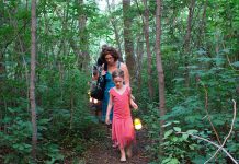 GreenUP's sunset lantern walk through the trees of Ecology Park is a tradition that leaves an impact on those who participate. Family Night will once again close with this ceremonial experience on August 27, 2026. (Photo: GreenUP)