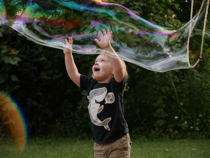 Outdoor play is important for child development, self-discovery, and cultivating a sense of wonder. The popular giant bubble making activity centre will be available at GreenUP Ecology Park's Family night on August 27. (Photo: GreenUP)