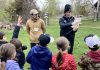Jakob Payne and Janelle Wiens, two Trent University learning garden teacher candidates, deliver a "Pollen Power" school program to a Grade 1 class at Ecology Park in Peterborough. GreenUP's education program offers a variety of hands-on, curriculum and experiential-based field trip options for students in kindergarten up to Grade 7. (Photo: Melanie Ellison / GreenUP)