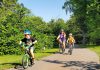 Laura, 8, and Adam, 6, are pedalling all over Peterborough with their mom Jennifer this summer as part of GreenUP's Summer Ride Club. "It's a really good habit to ... use your body to get places instead of just always driving," says Jennifer. "Building that confidence now will help them when they're older and they can be more reliant on themselves to get places." (Photo: Brett Throop / GreenUP)
