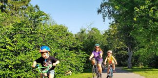 Laura, 8, and Adam, 6, are pedalling all over Peterborough with their mom Jennifer this summer as part of GreenUP's Summer Ride Club. "It's a really good habit to ... use your body to get places instead of just always driving," says Jennifer. "Building that confidence now will help them when they're older and they can be more reliant on themselves to get places." (Photo: Brett Throop / GreenUP)