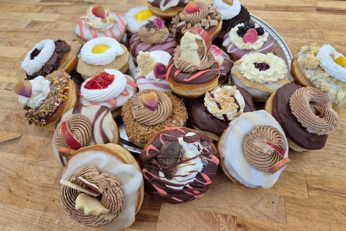 On the weekends, you'll find 24 varieties of homemade doughnut flavours when you step into Double DZ's Doughnuts and Diner in Cavan Monaghan just outside Peterborough. Before turning into an American diner with a drive thru, the business began as The Bull and Spud Food Truck, operating from 2018 to 2021. (Photo courtesy of Double DZ's Doughnuts and Diner)