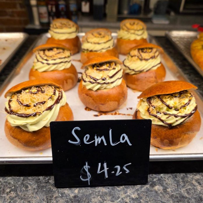 After opening in December 2025, LóLa Cakes and Coffee has already become well-known for serving high-quality coffee, custom cakes, and delectable baked goods. The homemade pastries are inspired by owner chef Nino Ante's travels around the world, such as the traditional Nordic sweet roll known as semla, pictured here with pistachio cream with kataifi (a Middle Eastern shredded pastry dough) and chocolate. (Photo courtesy of LóLa Cakes and Coffee)