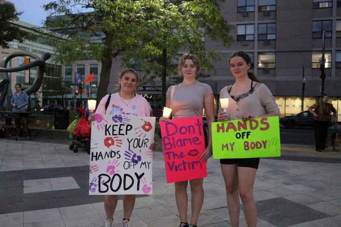 Participants with signs during the Kawartha Sexual Assault Centre's annual "Take Back the Night" event on September 18, 2025. Advocates say the onus should be on how to change the culture and response around sexual assault, rather than asking people to change their behaviour to prevent risk and protect themselves. The 2026 event runs from 5 to 9 p.m. on Thursday, September 17 outside in the Peterborough Square Courtyard. (Photo: Julia Lawrence)