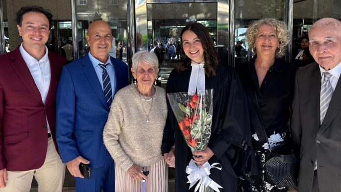 LLF Lawyers associate lawyer Ruby Byrne (fourth from the left) with her family (left to right): brother Daniel Byrne, father Jim Byrne, grandmother Rose Marie Byrne, mother Judy Byrne, and grandfather Murray Byrne. The first one in her family to attend university, Ruby remains grateful for her family's support and says she's proud to be a Byrne.  (Photo courtesy of Ruby Byrne)