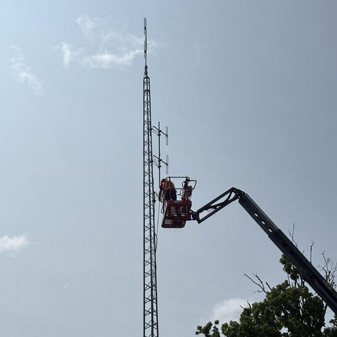 Contractors completed an upgrade to the radio tower at Wilson Park / Woodview Fire Station 1 in North Kawartha Township on July 30, 2026 to improve communications for fire services and public works across the township. While the North Kawartha Fire Department has relied on a repeater tower in Apsley for dispatch and operational communications, the Apsley tower is providing inadequate coverage in the southern part of the township due to several factors including distance, antenna shadowing (obstacles blocking the signal), and interference caused by additional telecommunications radios also installed on the tower. (Photo: Edward Hilton / North Kawartha Township)