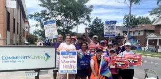 OPSEU Local 358 president Jessica Bushey (front left) with developmental services workers and supporters in front of the Community Living Trent Highlands office on Aylmer Street in Peterborough on June 12, 2026. (Photo: Bethan Bates / kawarthaNOW)