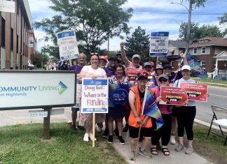 OPSEU Local 358 president Jessica Bushey (front left) with developmental services workers and supporters in front of the Community Living Trent Highlands office on Aylmer Street in Peterborough on June 12, 2026. (Photo: Bethan Bates / kawarthaNOW)