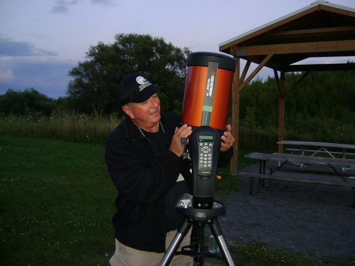 A member of the Peterborough Astronomical Association with a telescope during the association's 2024 Perseid meteor shower viewing event at Harold Town Conservation Area. (Photo: Dianne Denton)