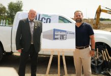 Millwright Regional Council director of public affairs and strategic initiatives Chris Sutton and Northumberland-Peterborough South MPP and Minister of Labour, Immigration, Training and Skills Development David Piccini alongside a rendering of the new skilled trades training centre under construction in the Port Hope Business Park during an announcement on August 20, 2026 of $9.8 million in provincial funding for the facility led by UBC Millwright Local 2309. (Photo: Office of David Piccini)