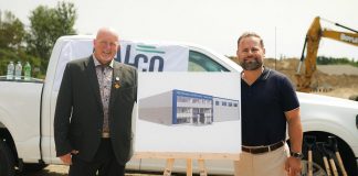 Millwright Regional Council director of public affairs and strategic initiatives Chris Sutton and Northumberland-Peterborough South MPP and Minister of Labour, Immigration, Training and Skills Development David Piccini alongside a rendering of the new skilled trades training centre under construction in the Port Hope Business Park during an announcement on August 20, 2026 of $9.8 million in provincial funding for the facility led by UBC Millwright Local 2309. (Photo: Office of David Piccini)